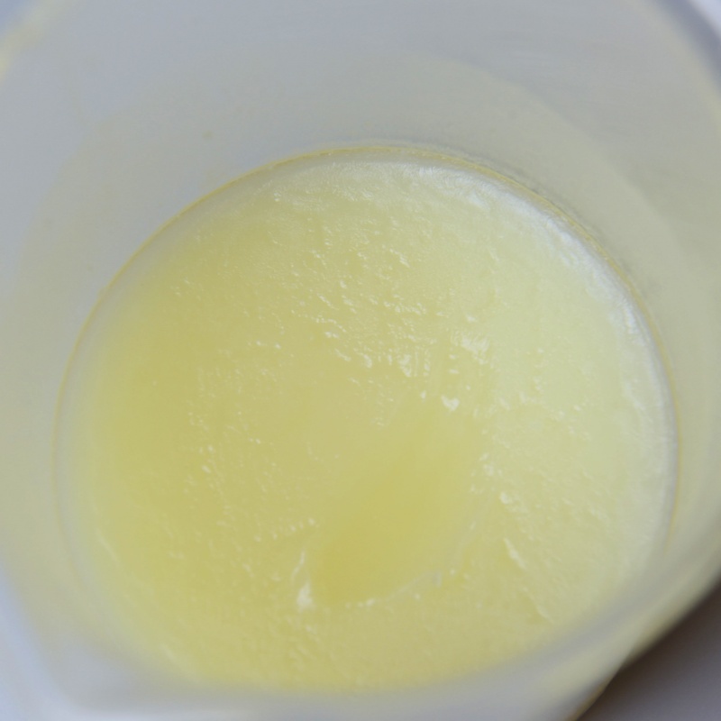 White creamy leather conditioner texture enriched with neatsfoot oil.